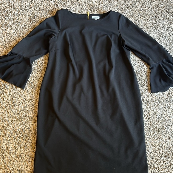 Calvin Klein's dress skims stretch, with button-accent bell sleeves for flair. - Picture 2 of 12